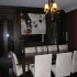 Built in wine cabinetry in fireplace wall of dining room.
